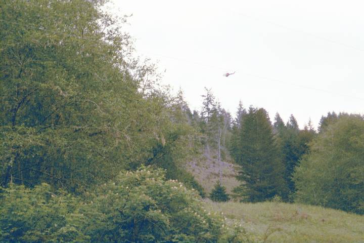 helicopter spraying toward spring